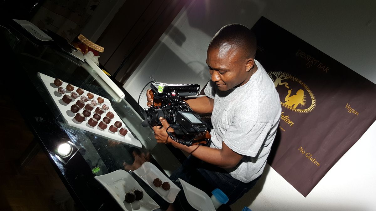 A photographer shooting a tray of pralines